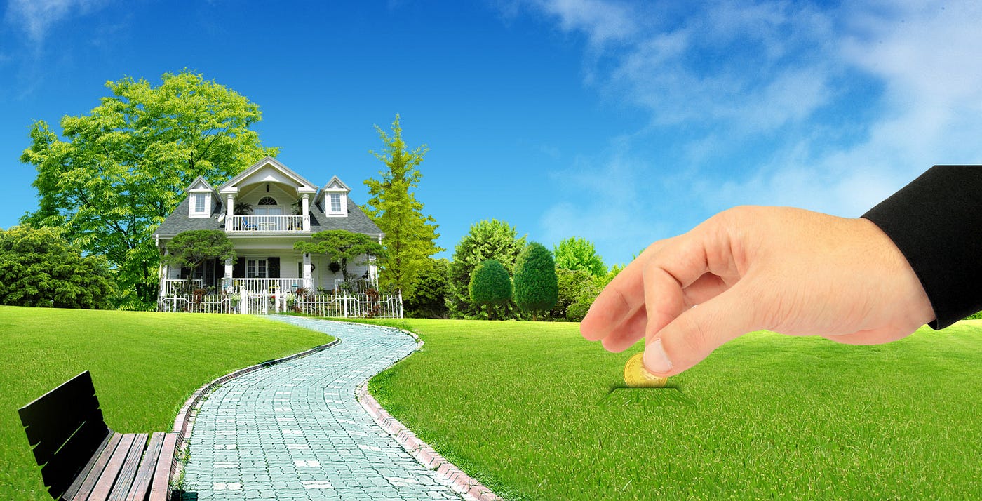 Graphic of a hand inserting a gold coin directly into a green lawn like a piggy bank next to a luxury suburban house, symbolizing real estate savings, property investment, and financial growth.