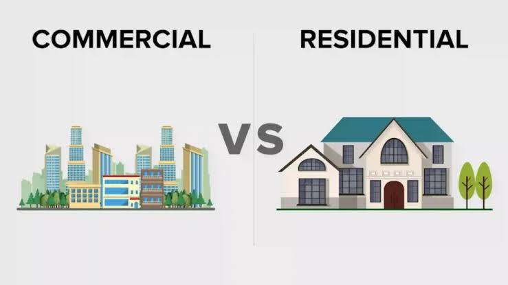 Infographic comparing Commercial vs Residential real estate, featuring vector illustrations of a corporate office building skyline on the left and a large two-storey single-family house on the right.