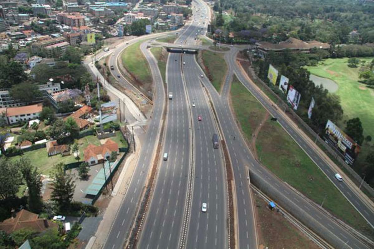 Aerial view of the multi-lane Thika Road superhighway corridor in Nairobi, showcasing modern transit infrastructure that accelerates surrounding commercial and residential land value.