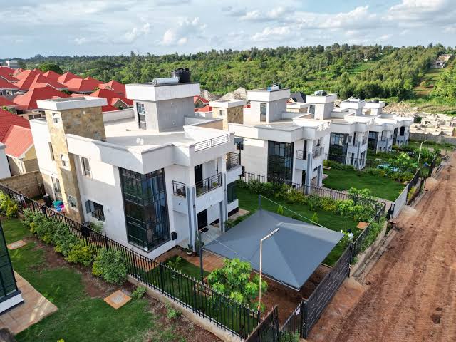 Aerial view of ultra-modern flat-roof maisonettes by Willstone Homes off Thika Road, Kenya, showcasing contemporary gated community housing developments for real estate acquisition.